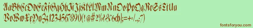 Zenfraxfreestylecondensed-Schriftart – Braune Schriften auf grünem Hintergrund