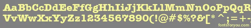 AmericanTypewriterBoldBt-fontti – keltaiset fontit harmaalla taustalla
