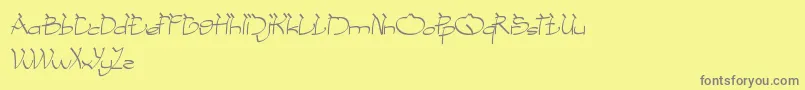 CobraOnCoconutTree-Schriftart – Graue Schriften auf gelbem Hintergrund
