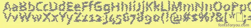 AstralWave-fontti – harmaat kirjasimet keltaisella taustalla