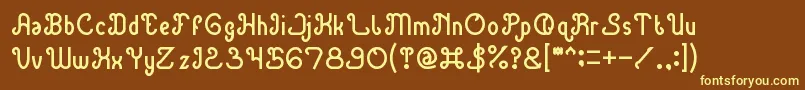 GreenAvocado-fontti – keltaiset fontit ruskealla taustalla