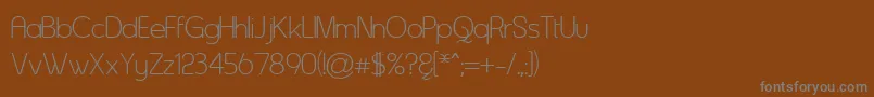 フォントAsenine ffy – 茶色の背景に灰色の文字