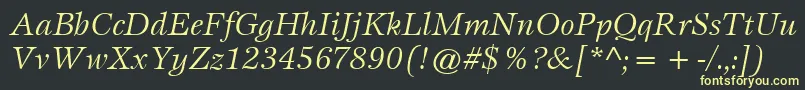 ItcEspritLtBookItalic-fontti – keltaiset fontit mustalla taustalla