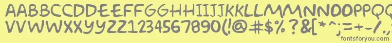 フォントAkbarPlain – 黄色の背景に灰色の文字