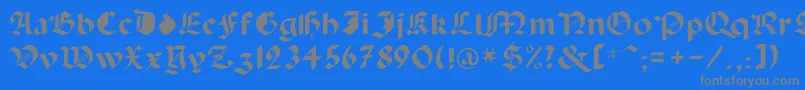 フォントCapinini – 青い背景に灰色の文字