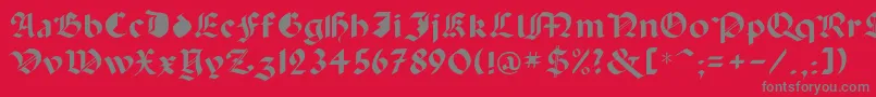 フォントCapinini – 赤い背景に灰色の文字