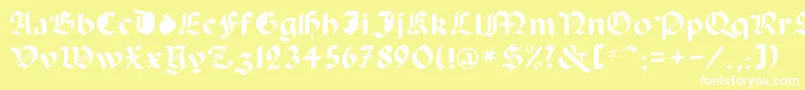 フォントCapinini – 黄色い背景に白い文字