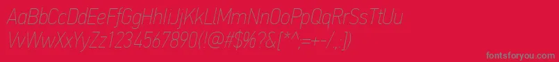 Fonte PfdintextcondproXthinitalic – fontes cinzas em um fundo vermelho