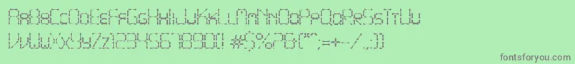 PointyIronFence-fontti – harmaat kirjasimet vihreällä taustalla