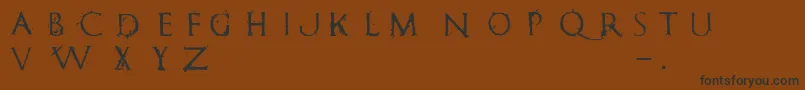 RomanumEst-fontti – mustat fontit ruskealla taustalla