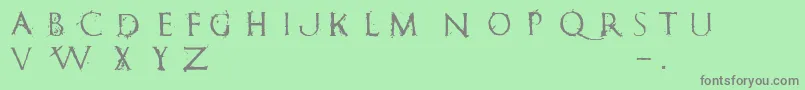 フォントRomanumEst – 緑の背景に灰色の文字