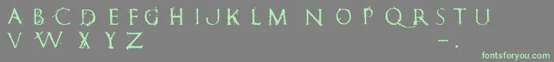 フォントRomanumEst – 灰色の背景に緑のフォント