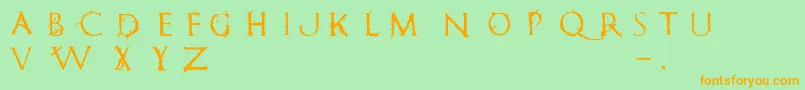 フォントRomanumEst – オレンジの文字が緑の背景にあります。