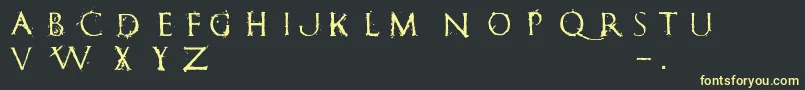 RomanumEst Font – Yellow Fonts on Black Background