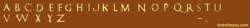 RomanumEst Font – Yellow Fonts on Brown Background