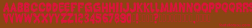 HantuKomKom Font – Red Fonts on Brown Background