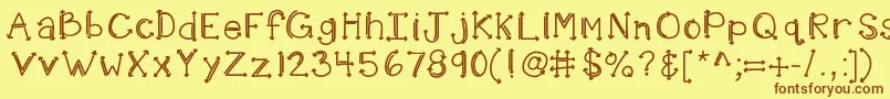 Fonte Kbshotinthedark – fontes marrons em um fundo amarelo