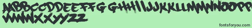フォントPaintcans09Free – 緑の背景に黒い文字