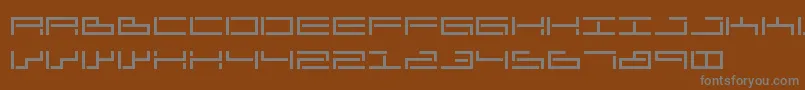 Czcionka SendharAnascript – szare czcionki na brązowym tle
