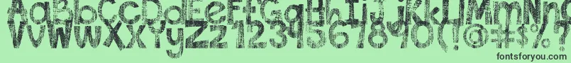 フォントDjbThisFontIsWorn – 緑の背景に黒い文字