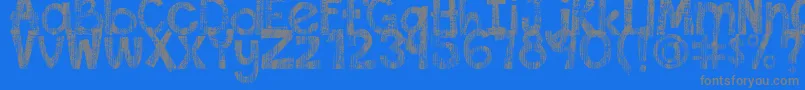 DjbThisFontIsWorn-fontti – harmaat kirjasimet sinisellä taustalla