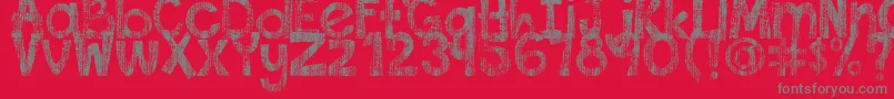 DjbThisFontIsWorn-fontti – harmaat kirjasimet punaisella taustalla