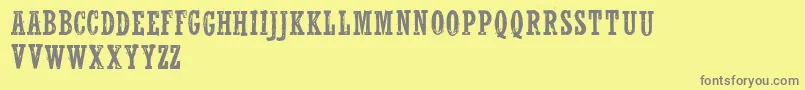 WolfrednelsonLight-fontti – harmaat kirjasimet keltaisella taustalla