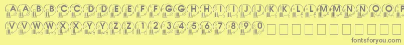 Whatposs ffy-fontti – harmaat kirjasimet keltaisella taustalla