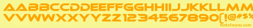 フォントEthnocentric – オレンジの文字が黄色の背景にあります。