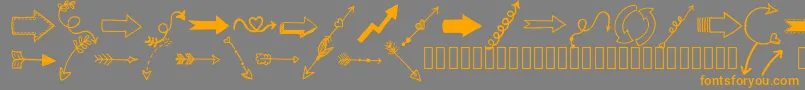 Tanaesteldoodlearrows01Regular-fontti – oranssit fontit harmaalla taustalla