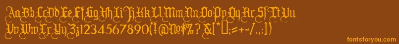 フォントWw2bh – オレンジ色の文字が茶色の背景にあります。