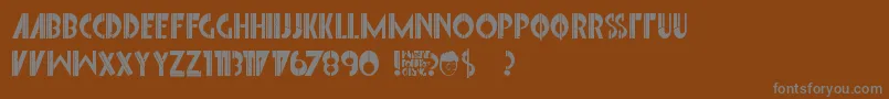 Więcej informacji o czcionce FontInterrupted Czcionka FontInterrupted – szare czcionki na brązowym tle