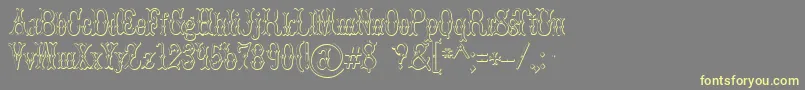 BrucedoublepicaBeveled Font – Yellow Fonts on Gray Background