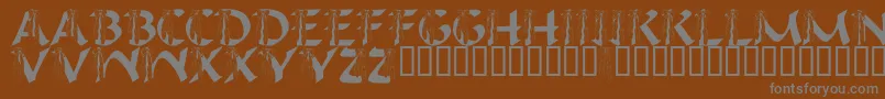 LmsIHopeYouDance-fontti – harmaat kirjasimet ruskealla taustalla