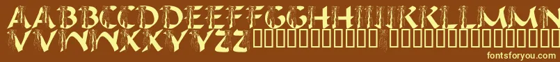 LmsIHopeYouDance-fontti – keltaiset fontit ruskealla taustalla