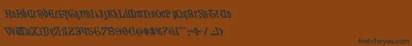 Westdelphialeft-Schriftart – Schwarze Schriften auf braunem Hintergrund