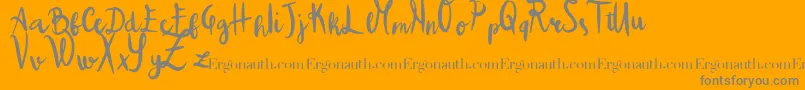 ColpaTua-Schriftart – Graue Schriften auf orangefarbenem Hintergrund