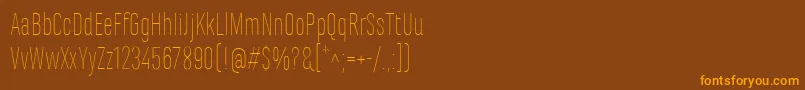 Шрифт MarianinaCnFyThin – оранжевые шрифты на коричневом фоне