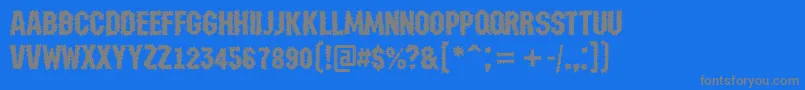 フォントAMachinanovabrk – 青い背景に灰色の文字