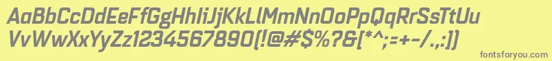 Quarcanormbolditalic-fontti – harmaat kirjasimet keltaisella taustalla