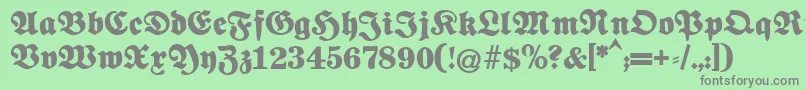 フォントFettenationalfraktur – 緑の背景に灰色の文字