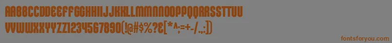 フォントKleptocracyTitlingCdBd – 茶色の文字が灰色の背景にあります。