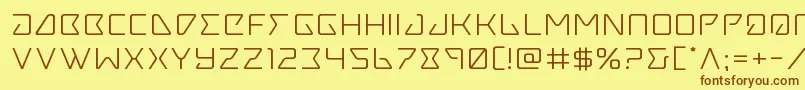 フォントTracerexpand – 茶色の文字が黄色の背景にあります。