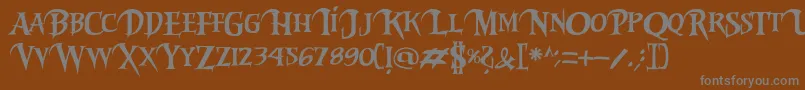 Riky2vamp-fontti – harmaat kirjasimet ruskealla taustalla
