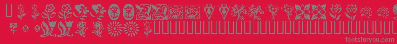 KrKatsFlowers-Schriftart – Graue Schriften auf rotem Hintergrund