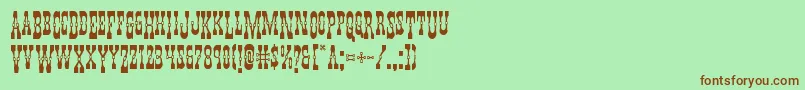 Youngerbrosdropcaps-fontti – ruskeat fontit vihreällä taustalla