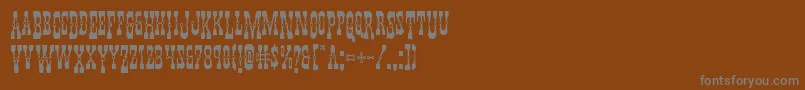 Youngerbrosdropcaps-Schriftart – Graue Schriften auf braunem Hintergrund