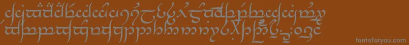 Weitere Informationen zur Tngan-Schriftart Tngan-Schriftart – Graue Schriften auf braunem Hintergrund
