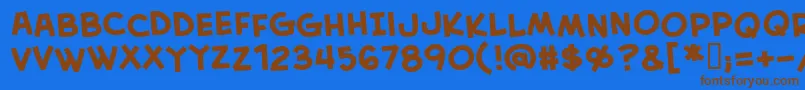 フォントCreativeblockBbBold – 茶色の文字が青い背景にあります。