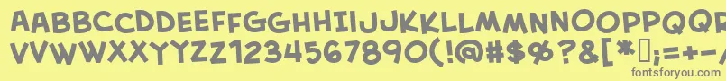 フォントCreativeblockBbBold – 黄色の背景に灰色の文字